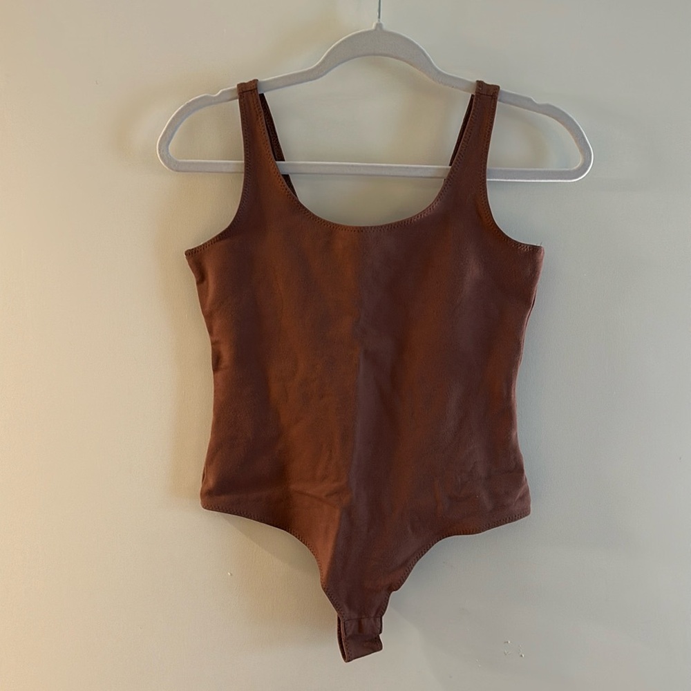 Brown body suit
